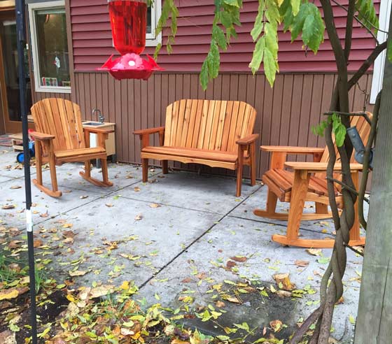 handcrafted garden rocking chairs in a patio setting